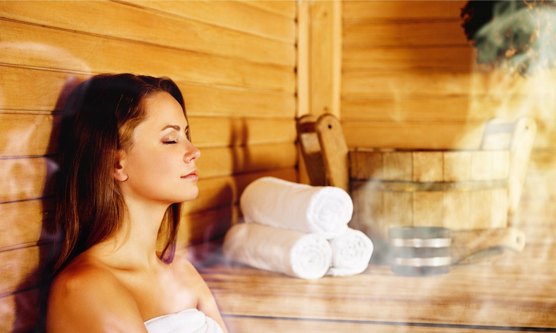 Woman relaxing in a sauna.