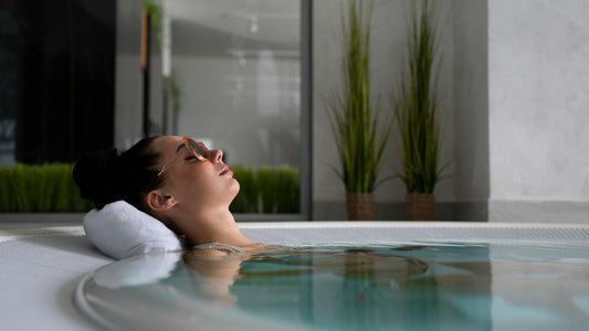 Woman relaxing in a hot tub.