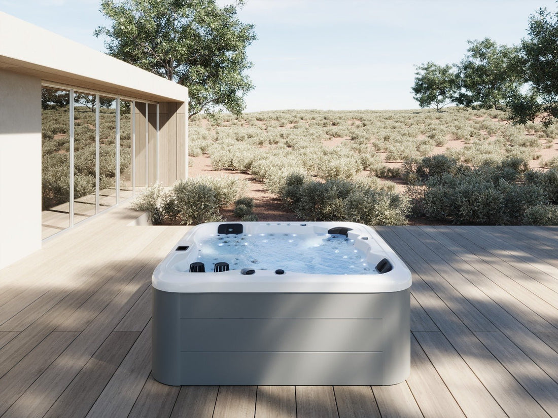 Illuminated whirlpool bath on an outdoor deck.