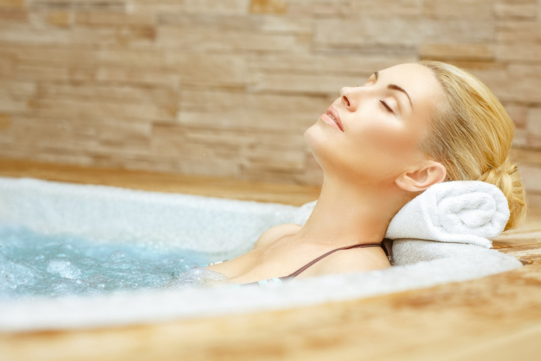 Woman relaxing in a hot tub.