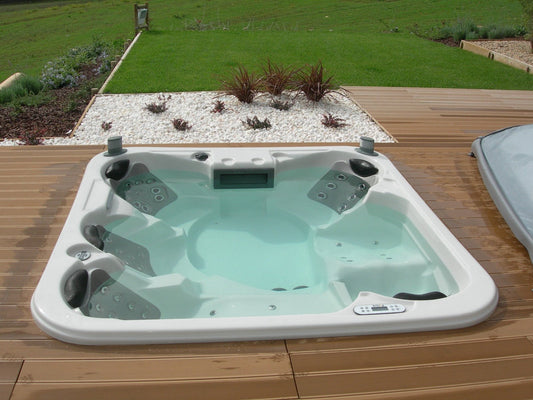 Hydromassage bath on a wooden deck