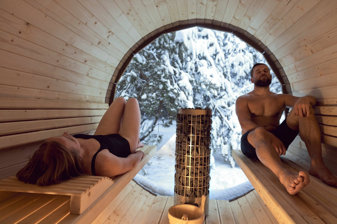 Man and woman relaxing in an outdoor sauna.