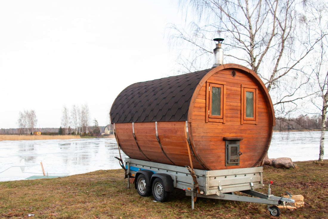 Barrel sauna in an open-air trailer.