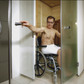 A man in a wheelchair using the SmartFold Sauna.