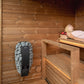 Nordic Dawn outdoor sauna with wooden benches in a sauna setting.