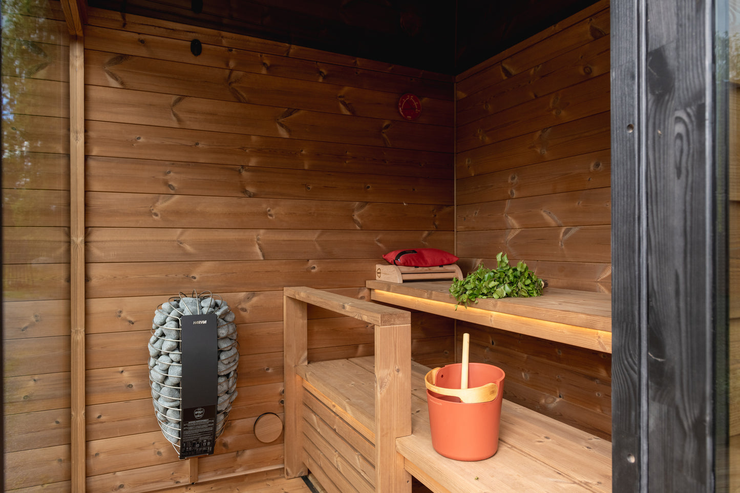 Nordic Dawn outdoor sauna in a cozy wooden setting.