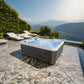 Hydra 170 Jacuzzi on patio overlooking mountains.