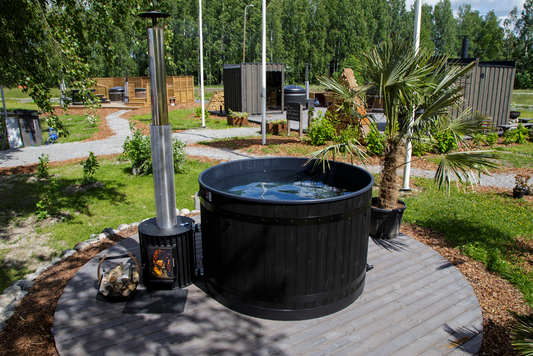 Harvia Legend outdoor hot tub with wood-burning stove.