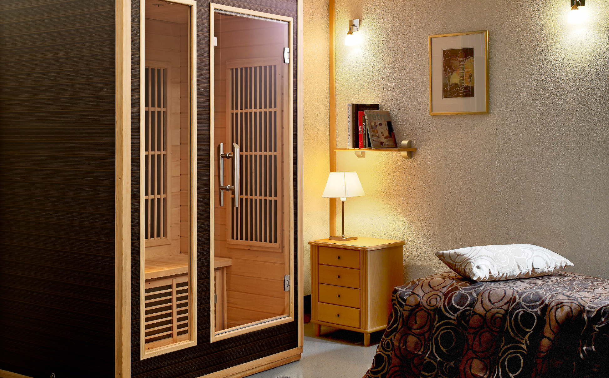 Radiant infrared sauna in bedroom with bed and lamp.