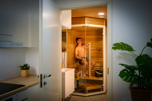 Man sitting in the Sirius Corner Sauna