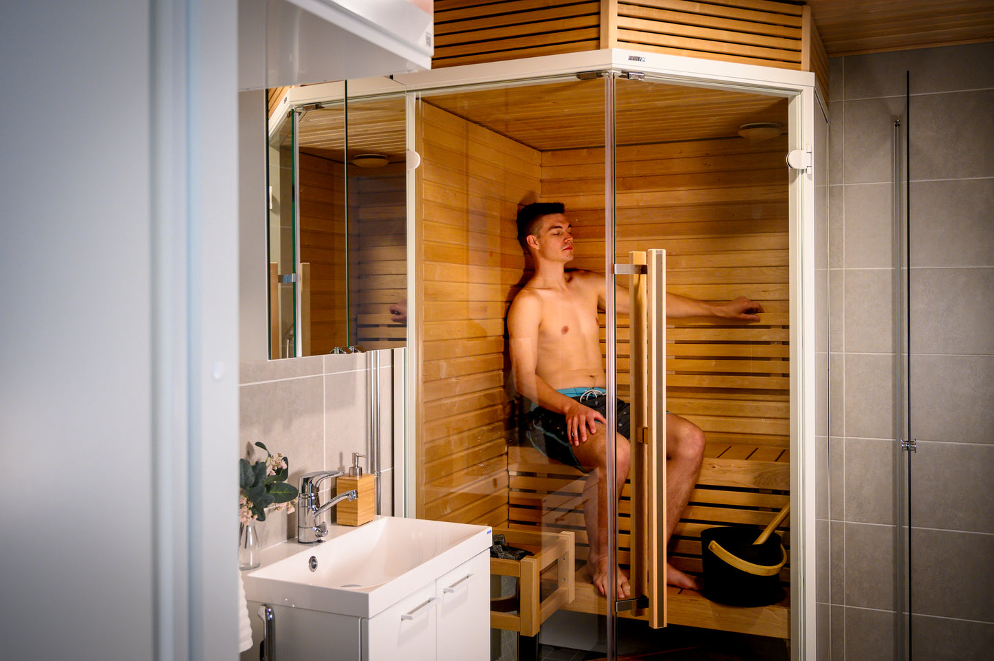 Man sitting in the Sirius Corner sauna