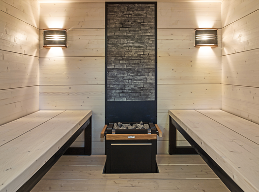 Solide sauna with wooden benches and fireplace.