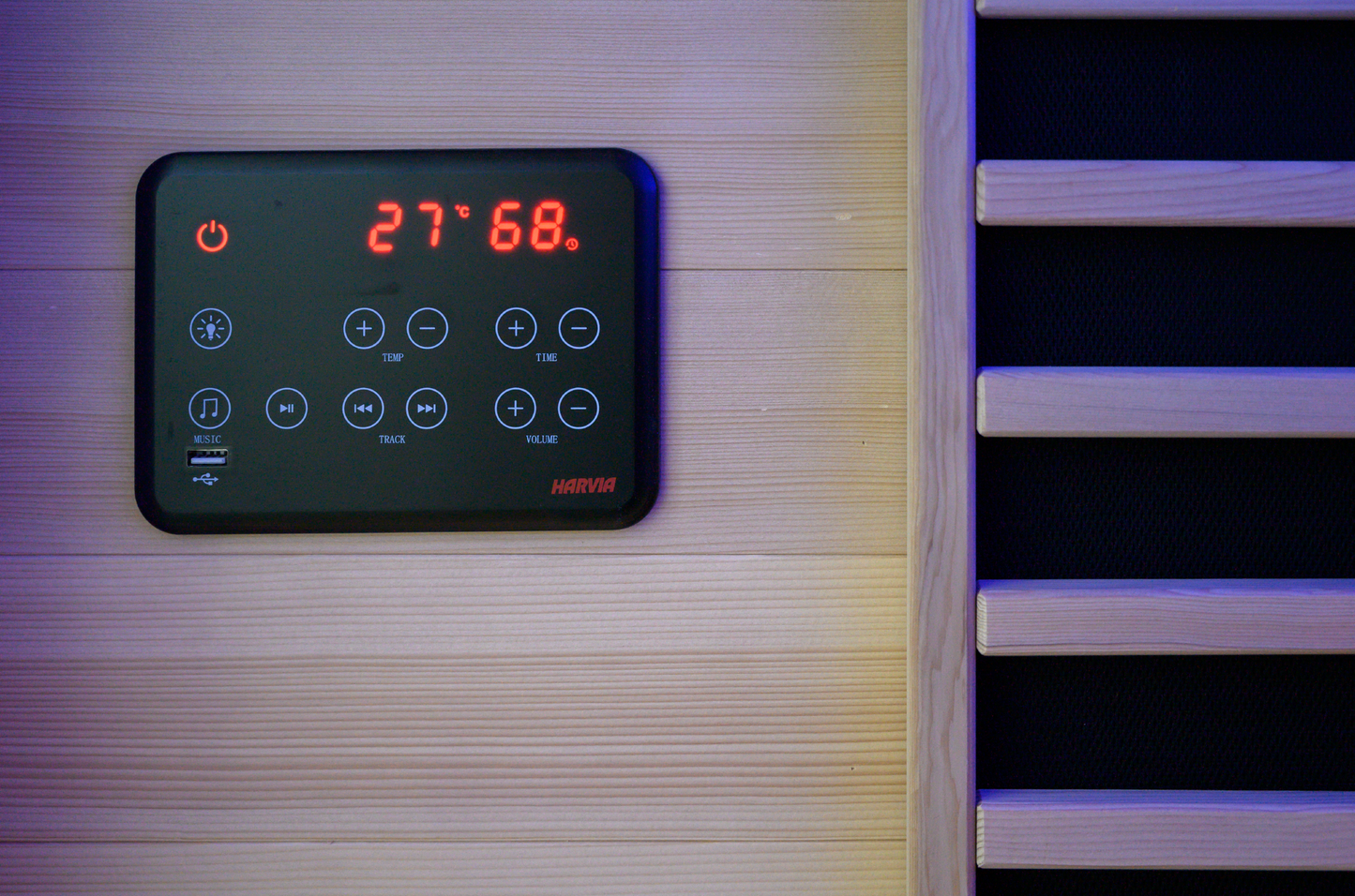 Spectrum infrared sauna with digital display and buttons.