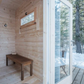 Outdoor sauna Saunamo Nordica with glass door and wooden finish.