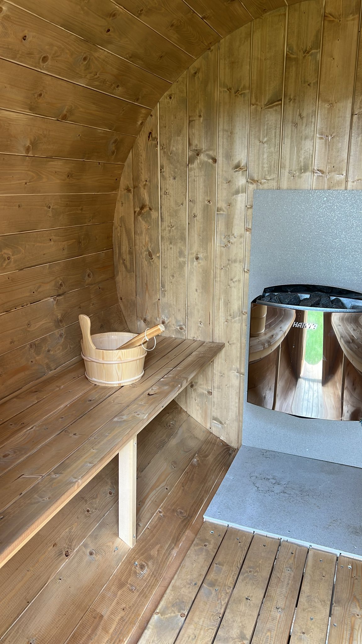 Outdoor sauna 230 in wooden surroundings.