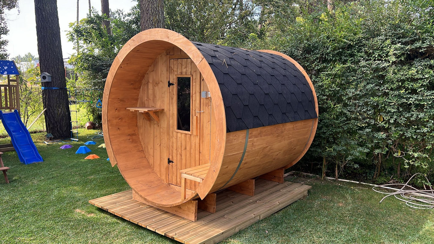 Outdoor barrel-shaped sauna 230 in the park.