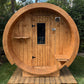 Outdoor sauna 230 in the shape of a barrel with door and window.