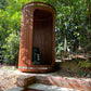 Barrel shower in a natural setting.