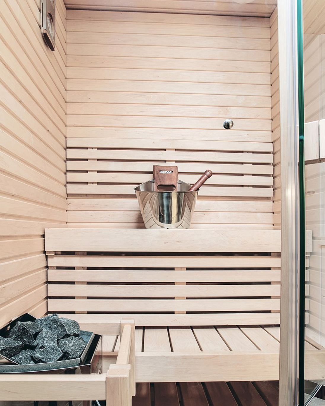 Sirius sauna with bucket and stones.