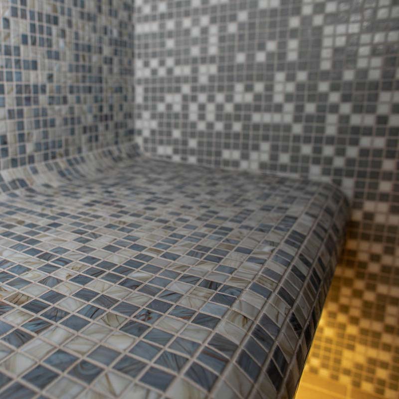 Tiled bench in the KUUT Outdoor Steam Sauna.