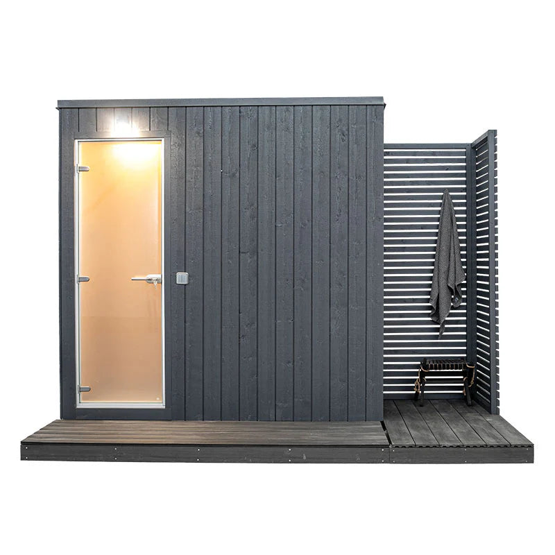 KUUT - Outdoor steam sauna with door and visible towel.