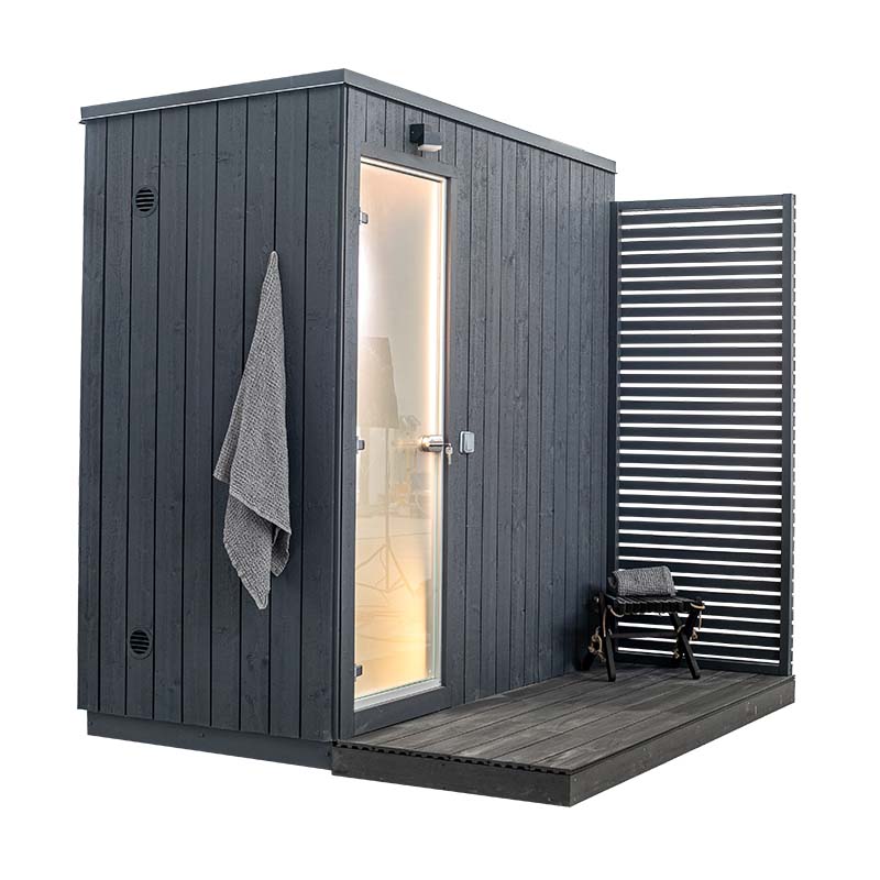 KUUT Outdoor Steam Sauna with visible door and chair.