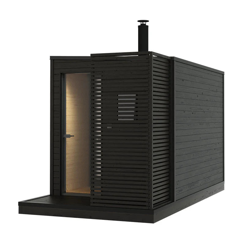 KUUT L wood-fired outdoor sauna with open door.