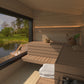 Outdoor sauna Saunamo Modular with lake and lawn views.