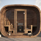 Wooden sauna Saunamo Cubus with fireplace and exterior view.