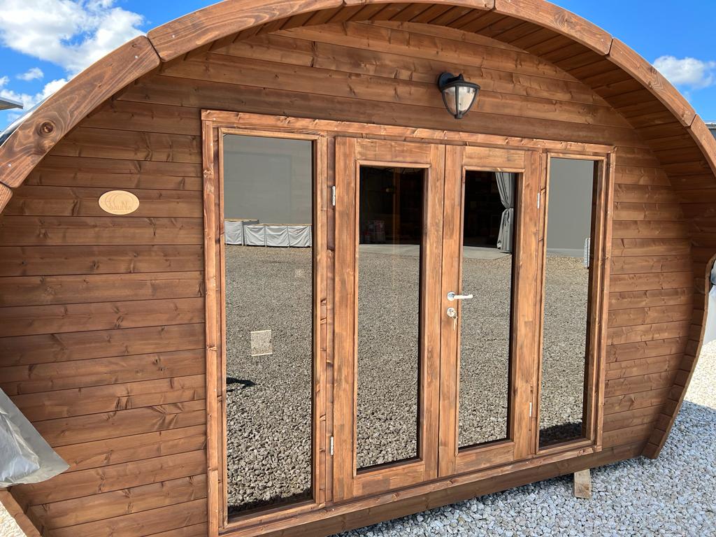 Spacious sauna Saunamo Hobbit 500 with 3 rooms and large windows.