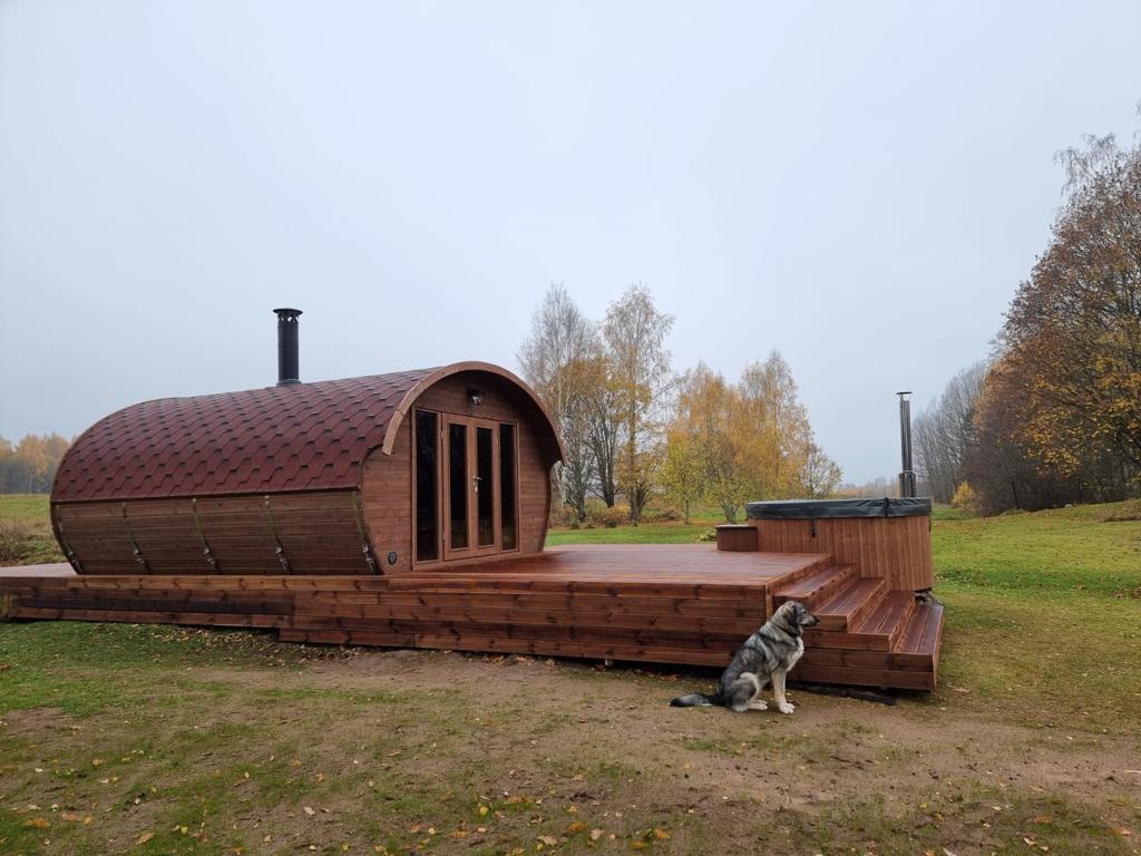 Sauna Saunamo Hobbit 500 next to wooden deck.