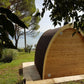 Saunamo Pod: wooden structure with chimney outdoors.