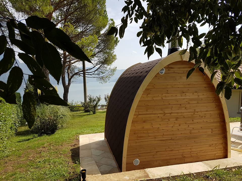 Saunamo Pod: wooden structure with chimney outdoors.