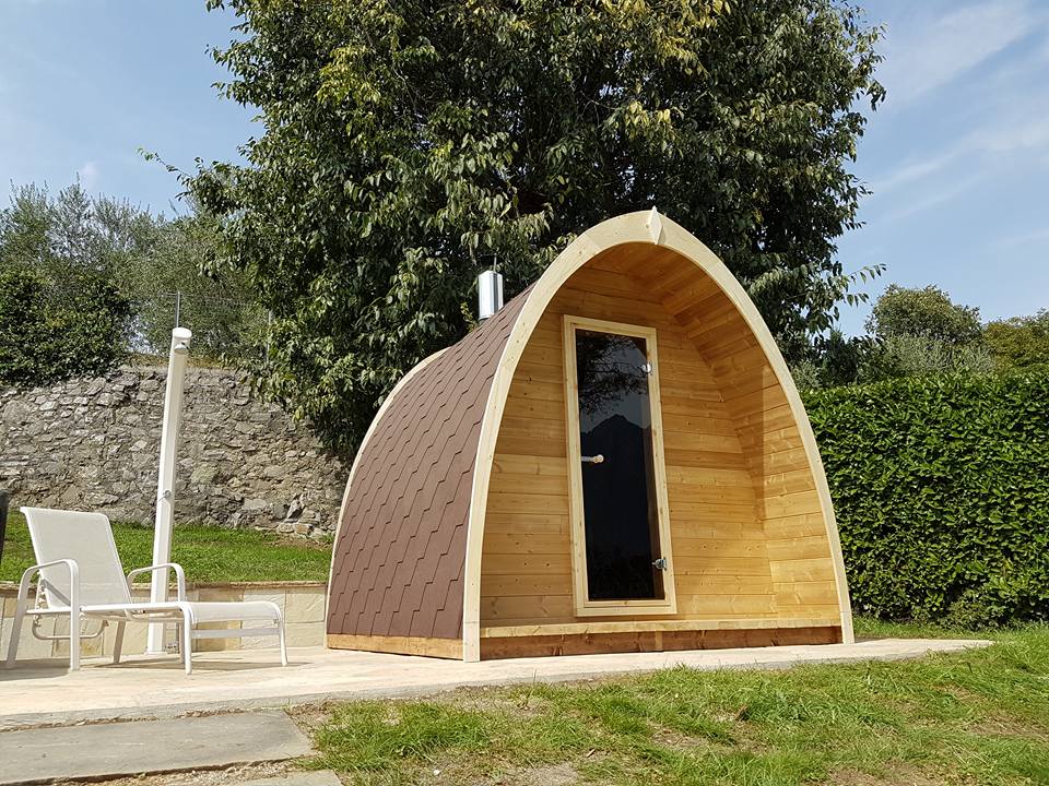 Saunamo Pod: wooden structure with door for outdoor sauna.