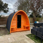 Wooden structure Saunamo Pod in a backyard.