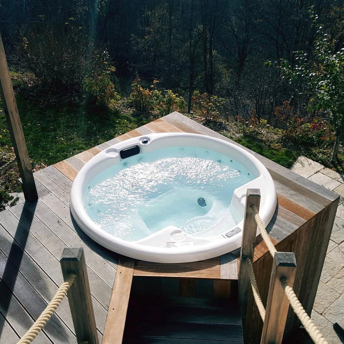 Hydromassage bathtub Saunamo Serena 210 on wooden deck.